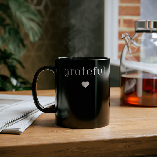 Grateful Black Mug- BPA and Lead-free, microwave & dishwasher-safe, and made of white, durable ceramic in 11-ounce and 15-ounce sizes.